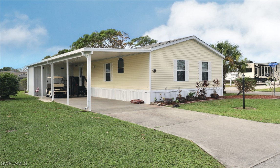 a front view of house with yard and green space