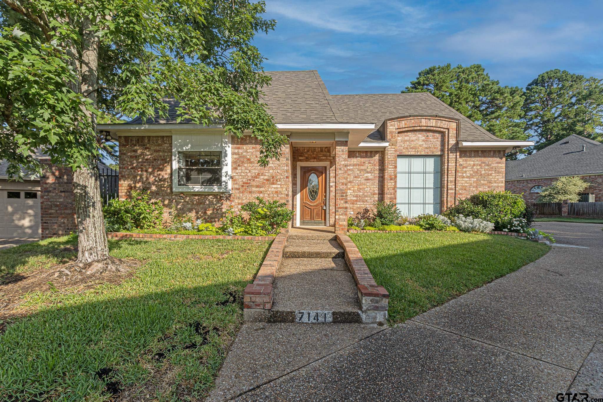 front view of a house with a yard