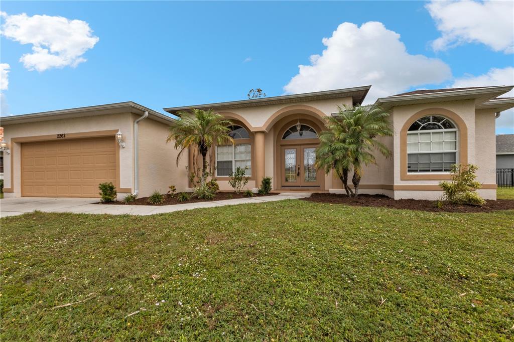 a front view of a house with a yard