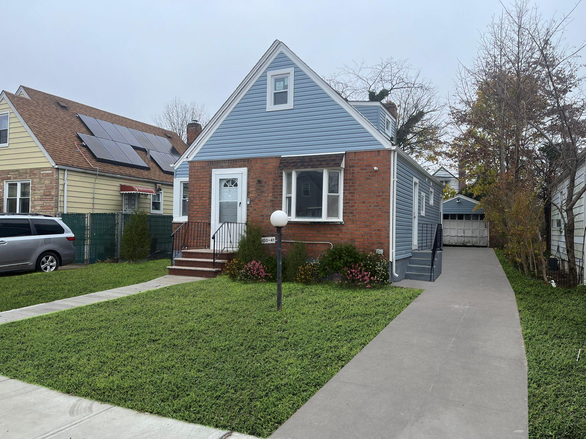 a front view of a house with a yard