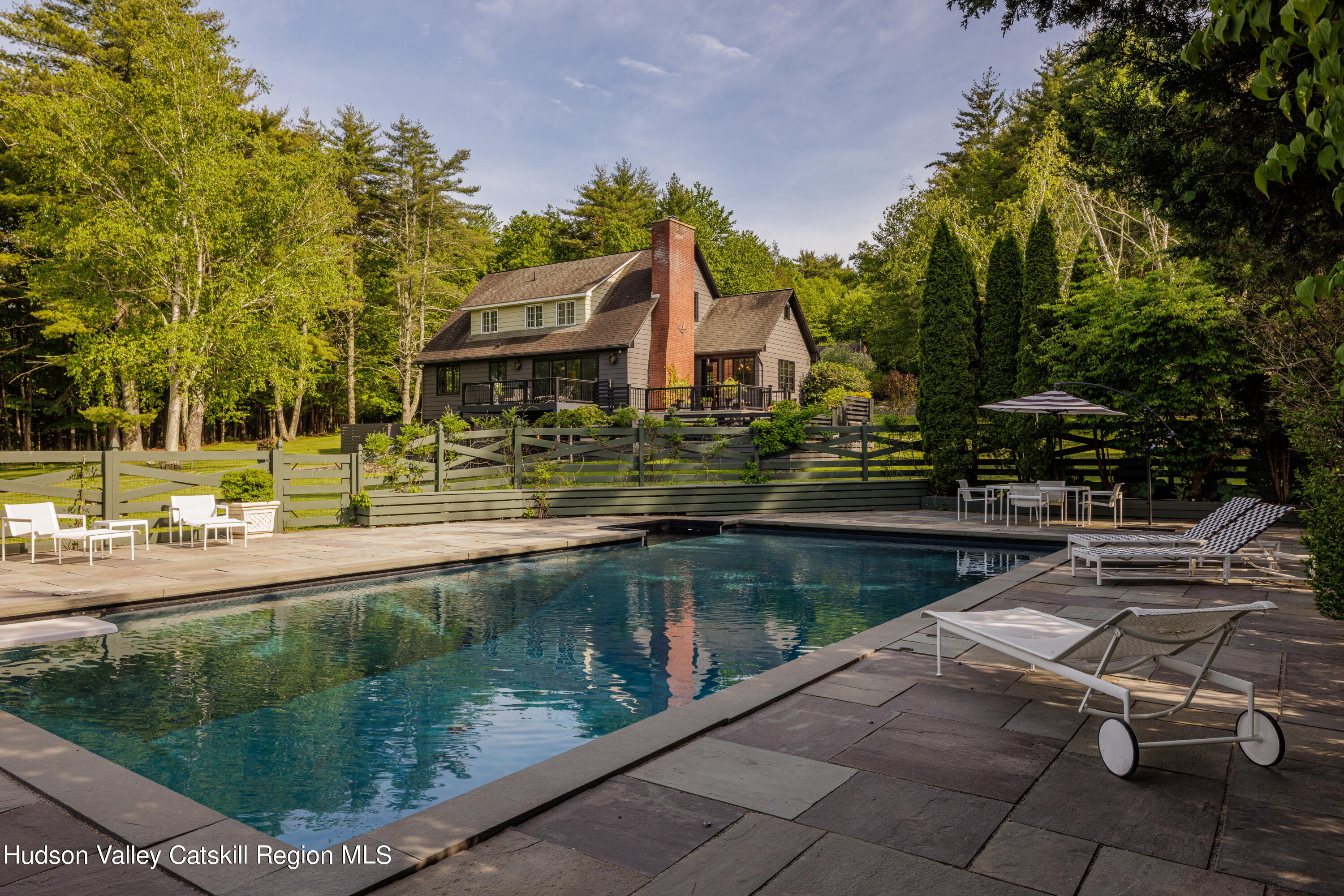 a swimming pool view with a lake view