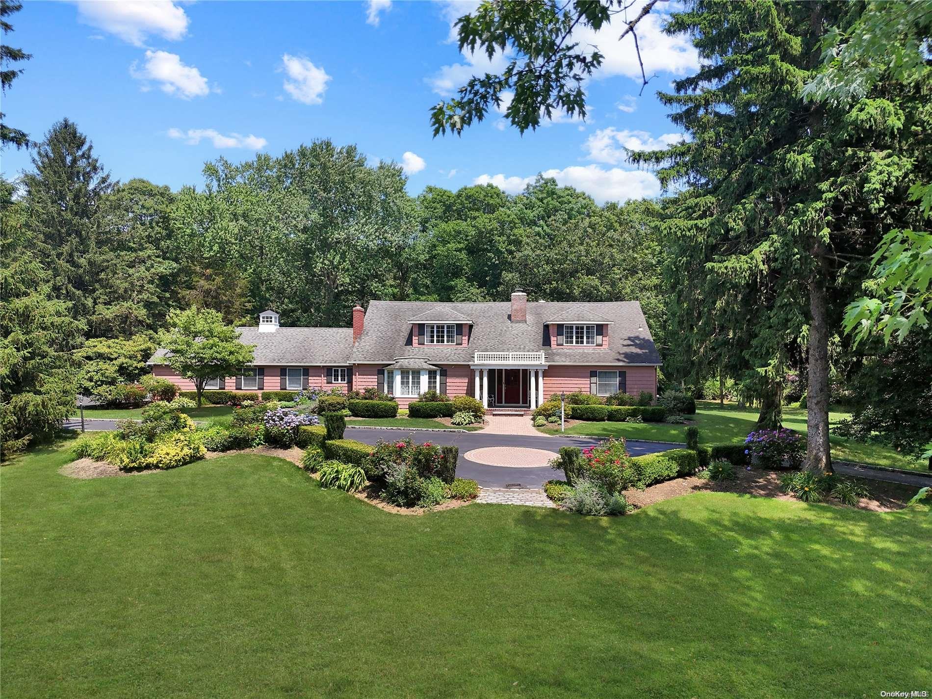 a aerial view of a house with swimming pool garden and patio