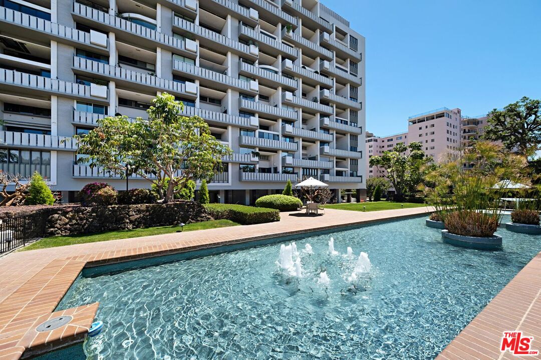 a view of a swimming pool with a garden