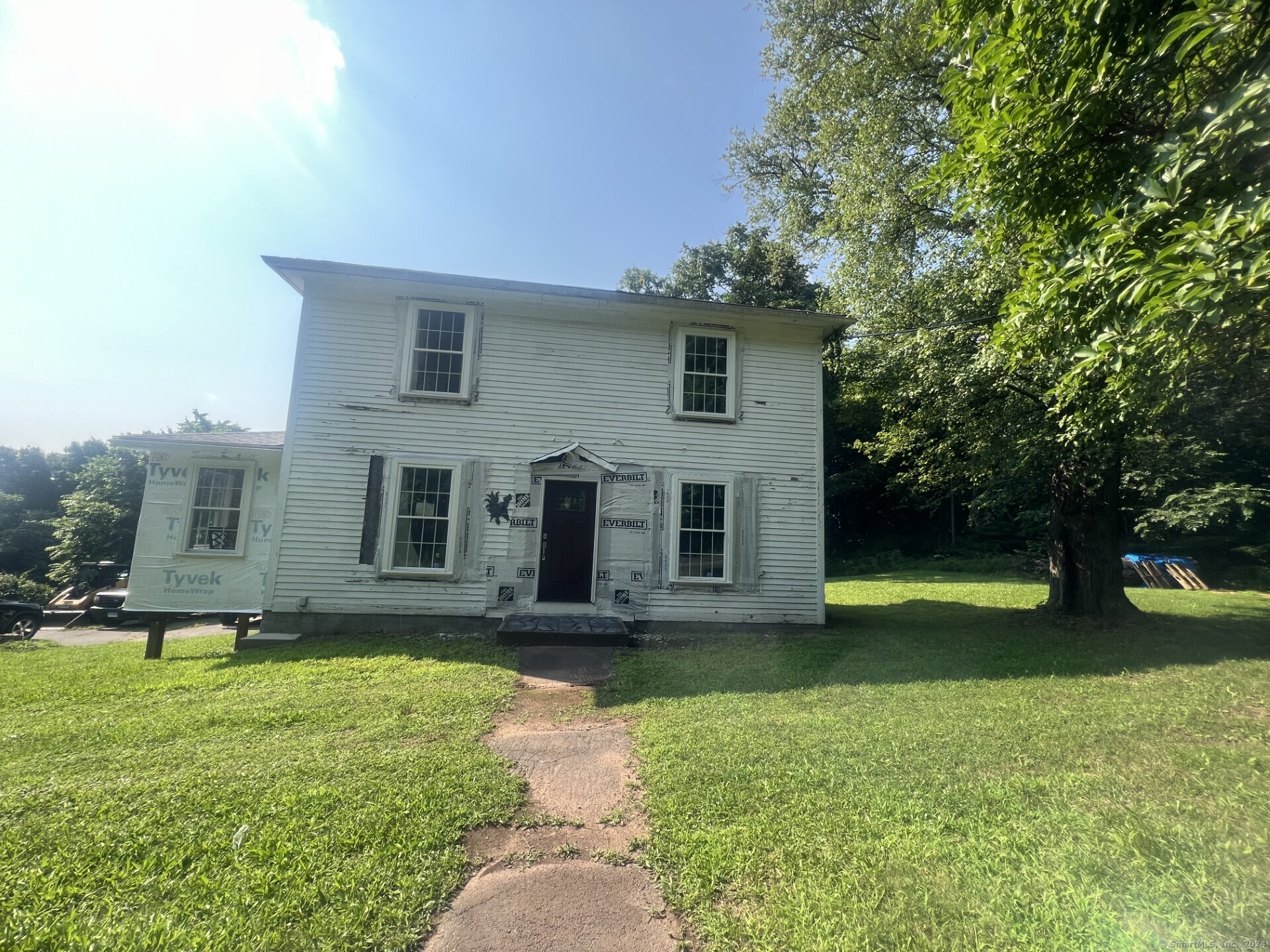 a front view of a house with garden