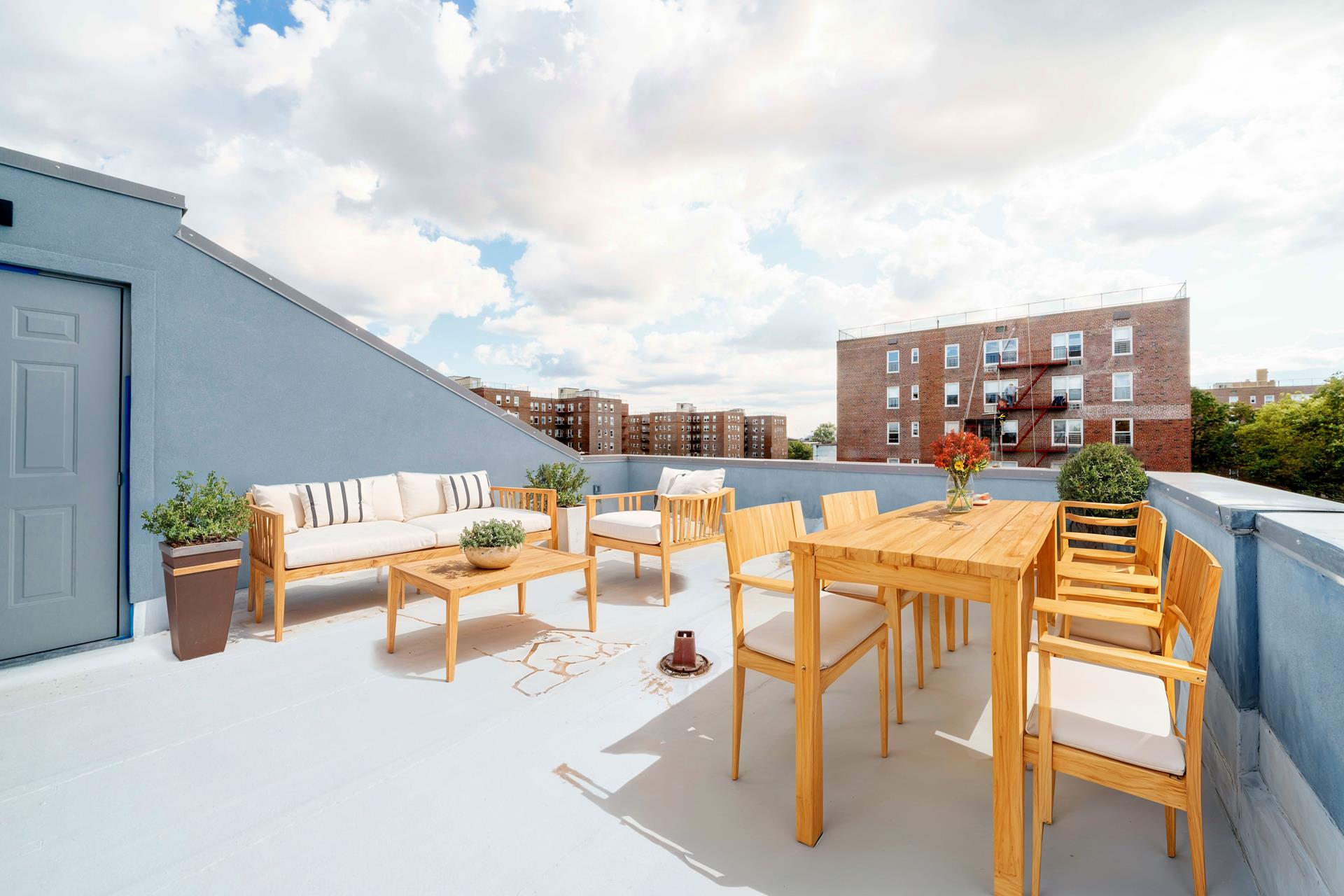 an outdoor patio with swimming pool and furniture