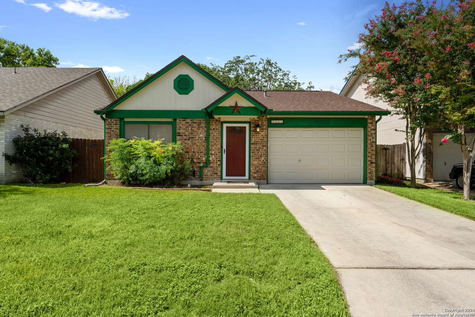 a front view of a house with garden