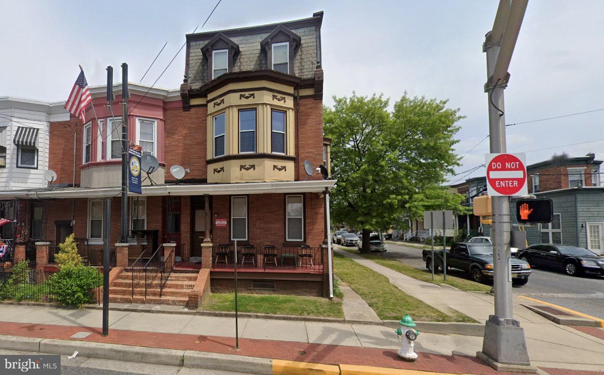 a front view of a building with street view