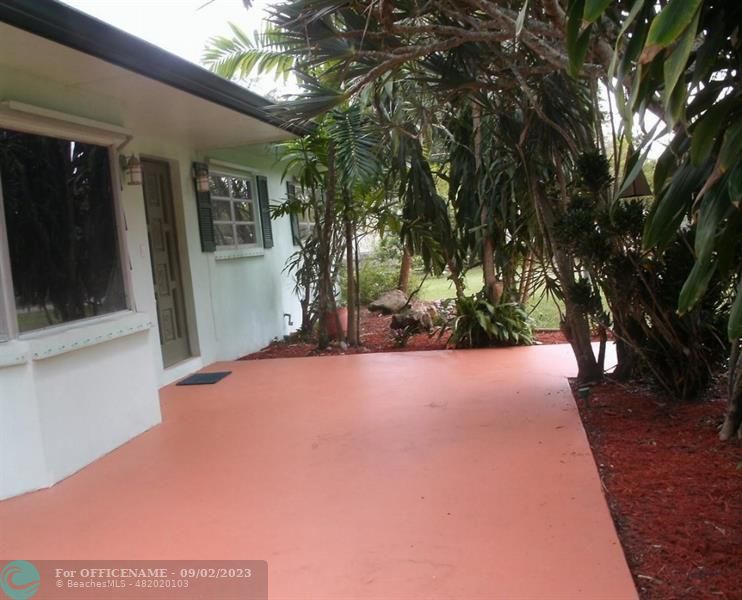 a view of a house with a tree