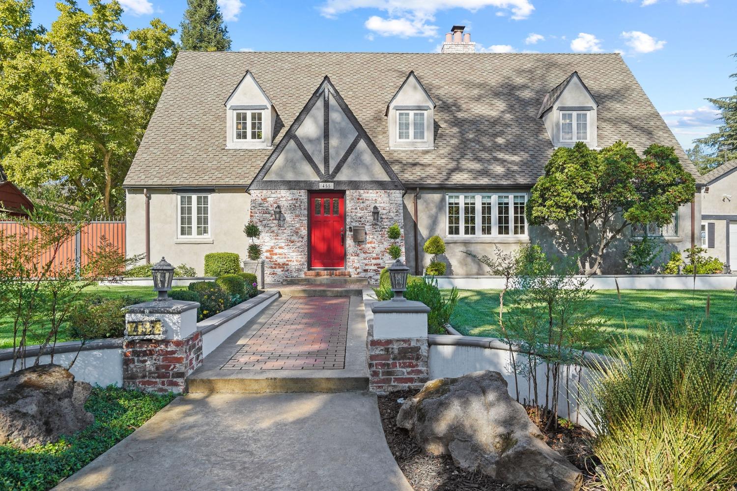 a front view of a house with garden