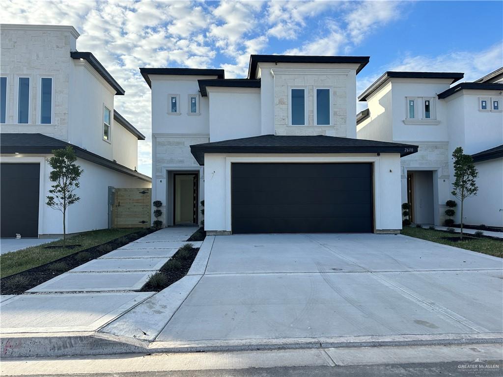 a front view of a house with a garage