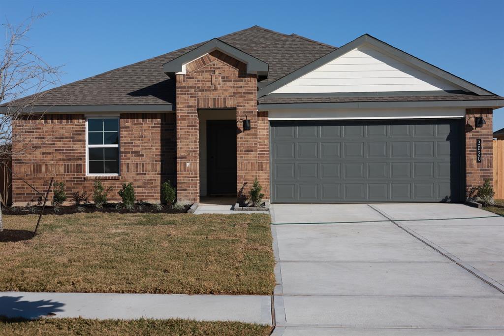 a front view of a house with garage