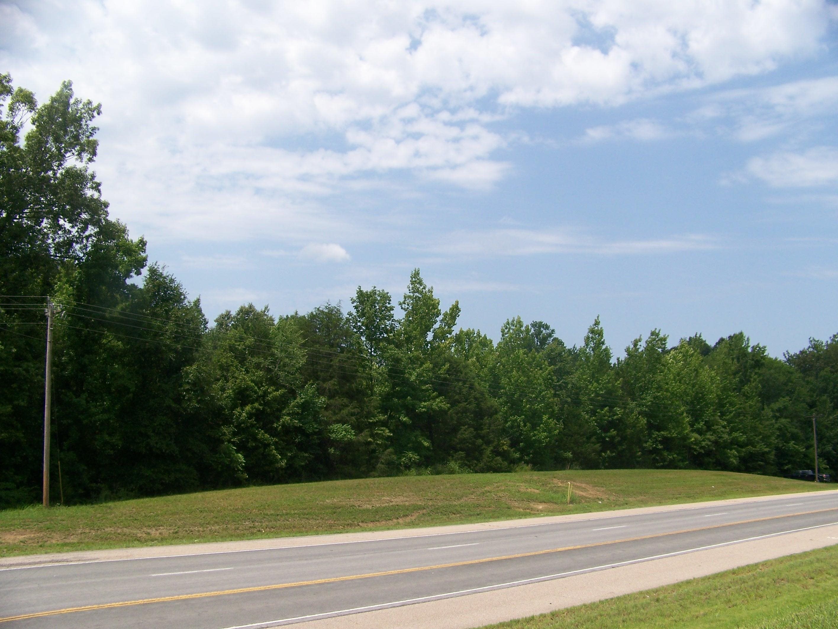 a view of a big yard and basketball court