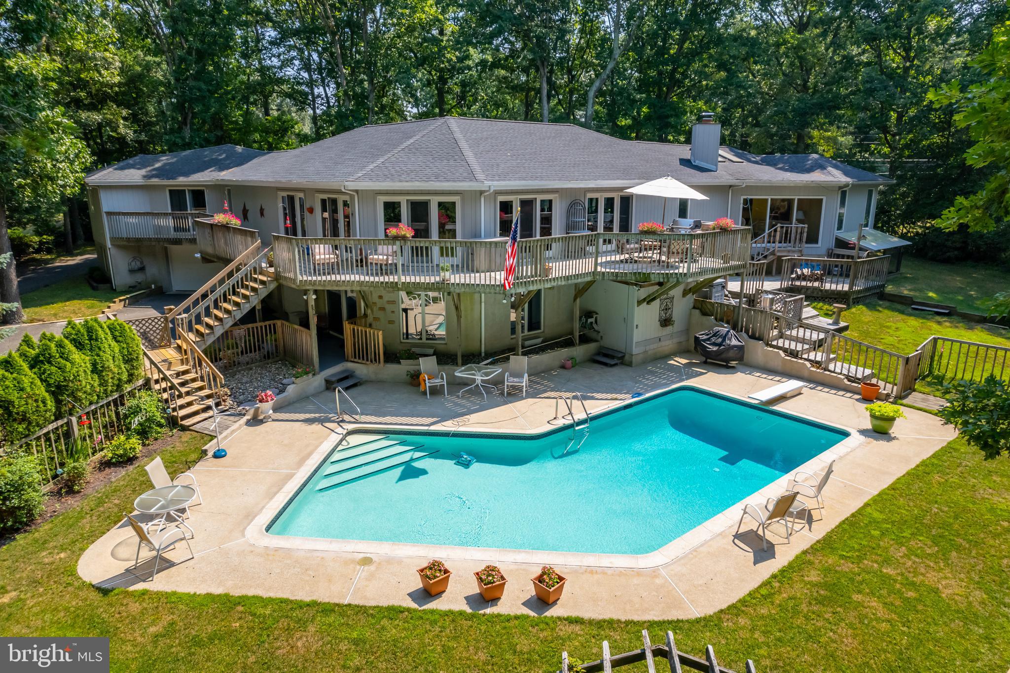 a view of a house with backyard patio and sitting area