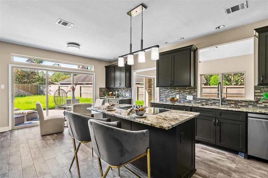 A fantastic gourmet kitchen provides ample space for family meals, meal prep & enjoying the large backyard beyond.