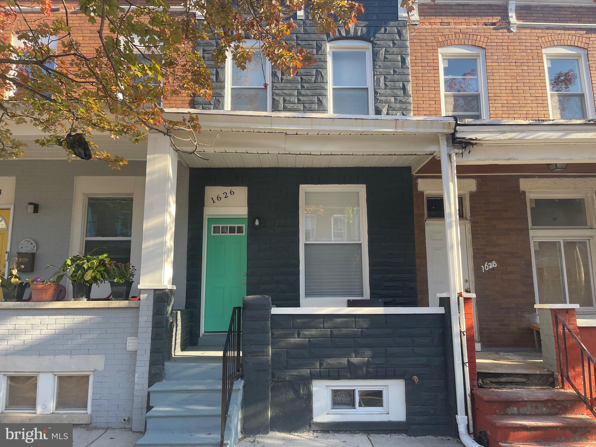 front view of a house with a small yard