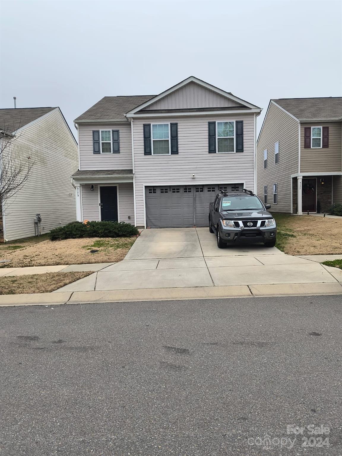 a car parked in front of a house