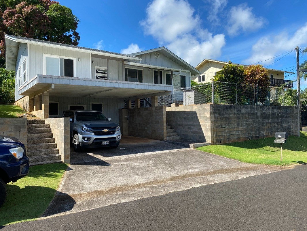 Front of home with two entrances to home.