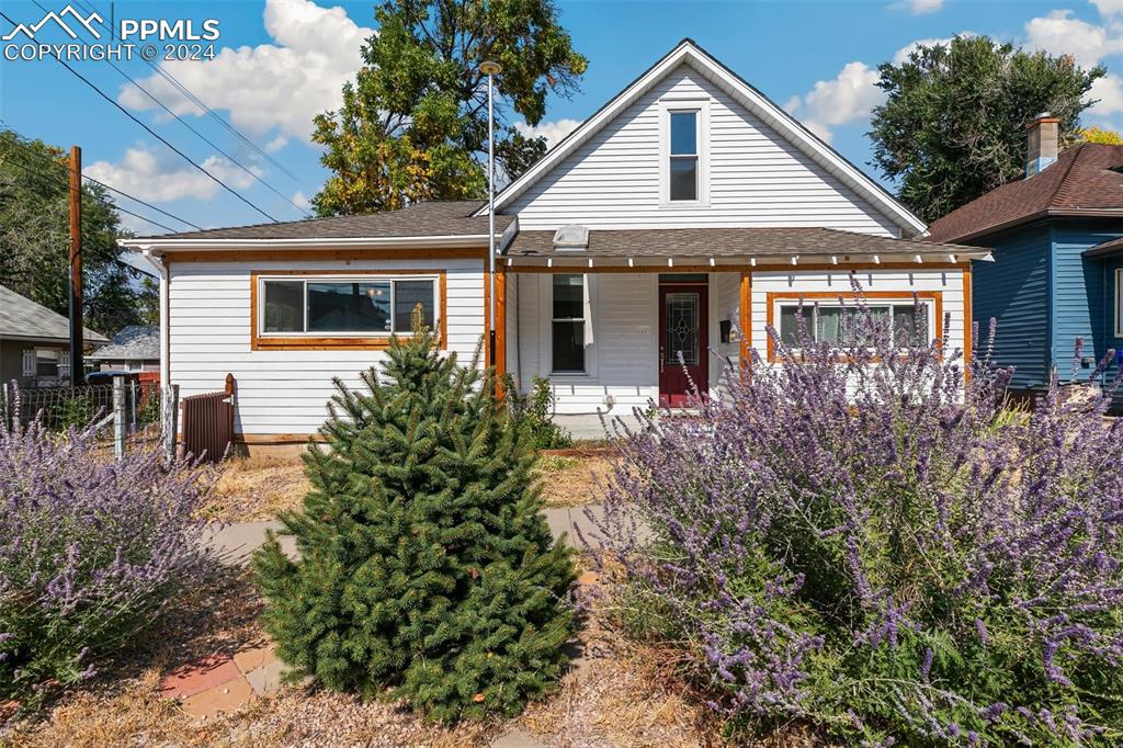 front view of a house with a yard