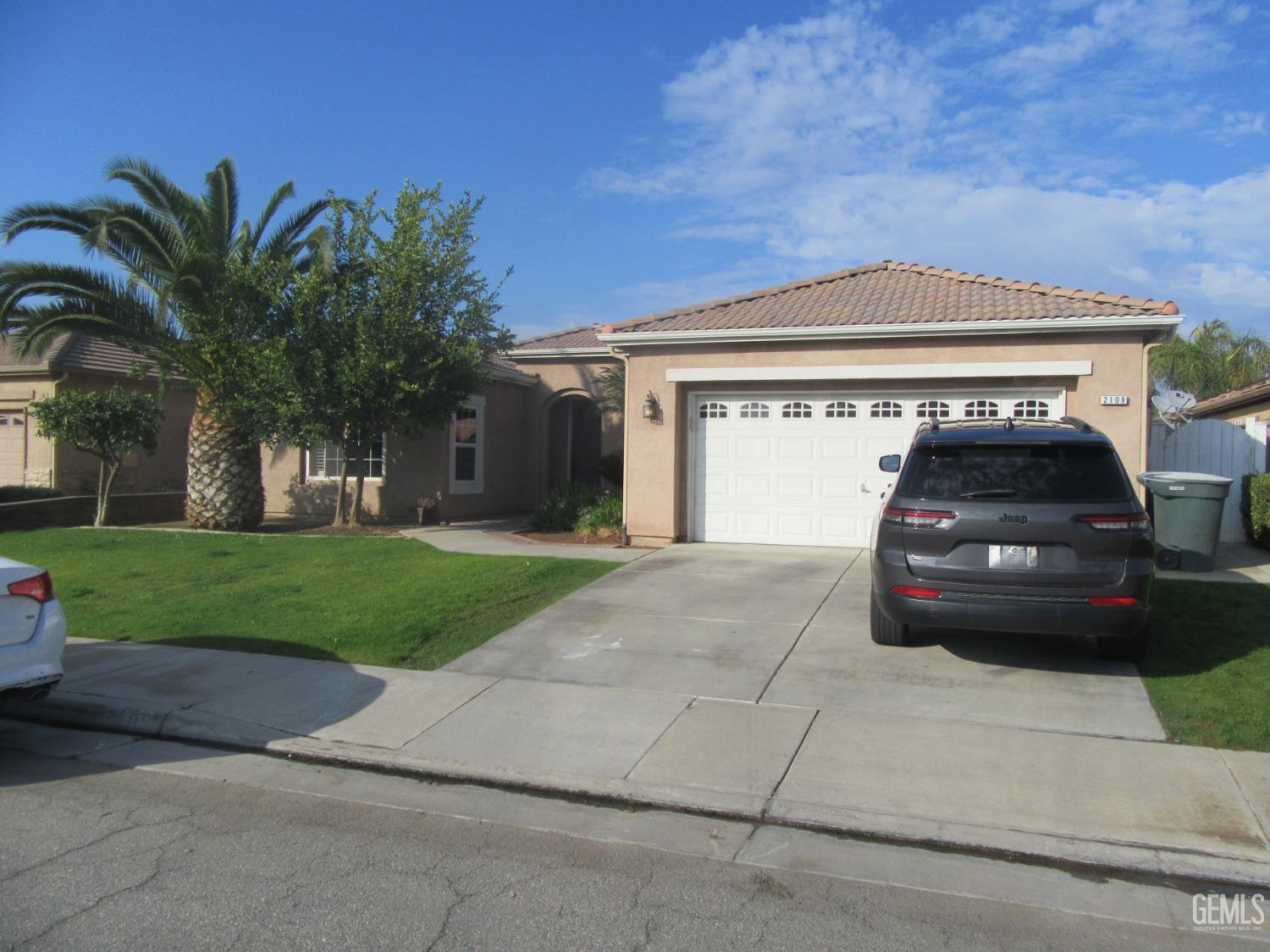 a car parked in front of a house