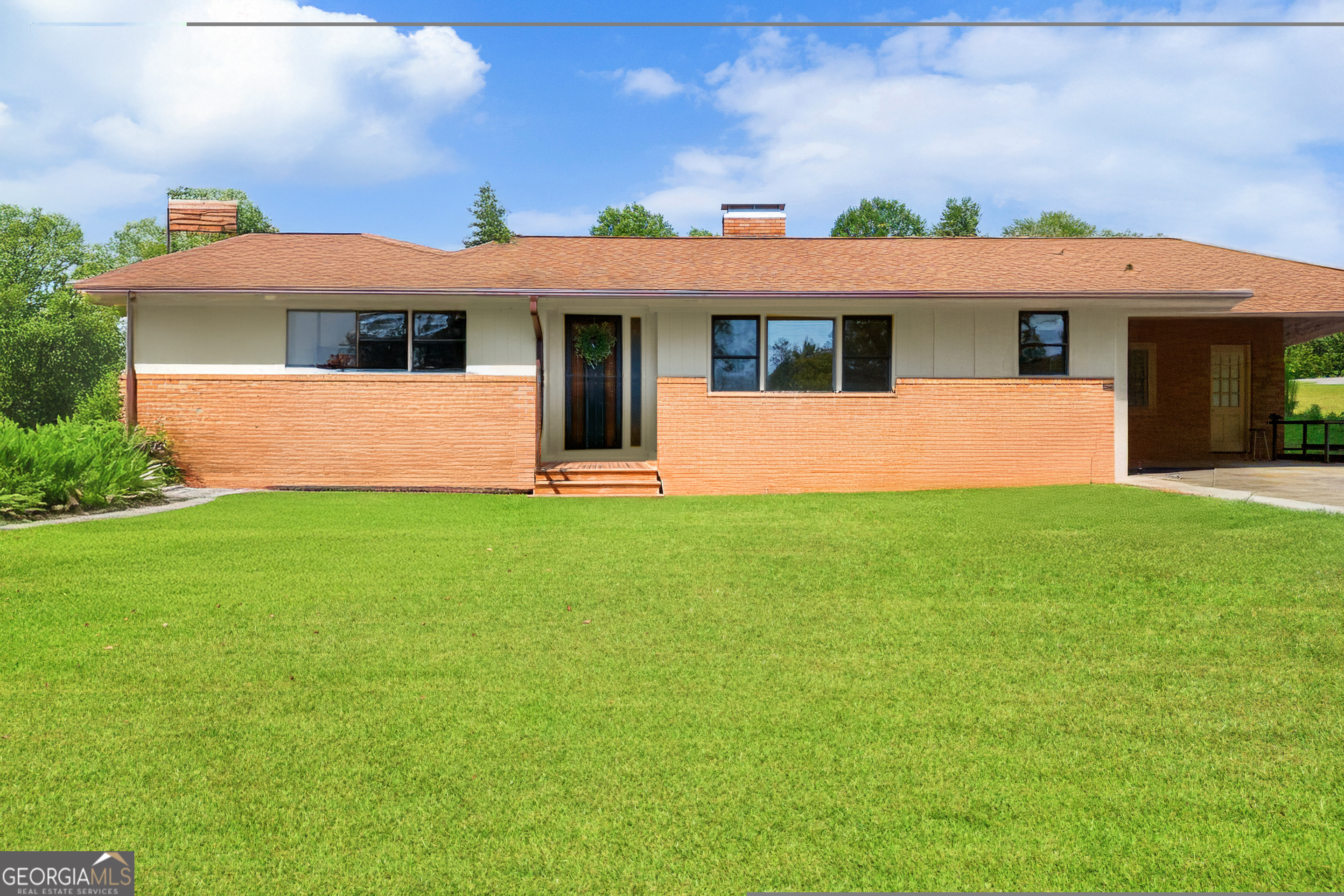 front view of a house with a yard