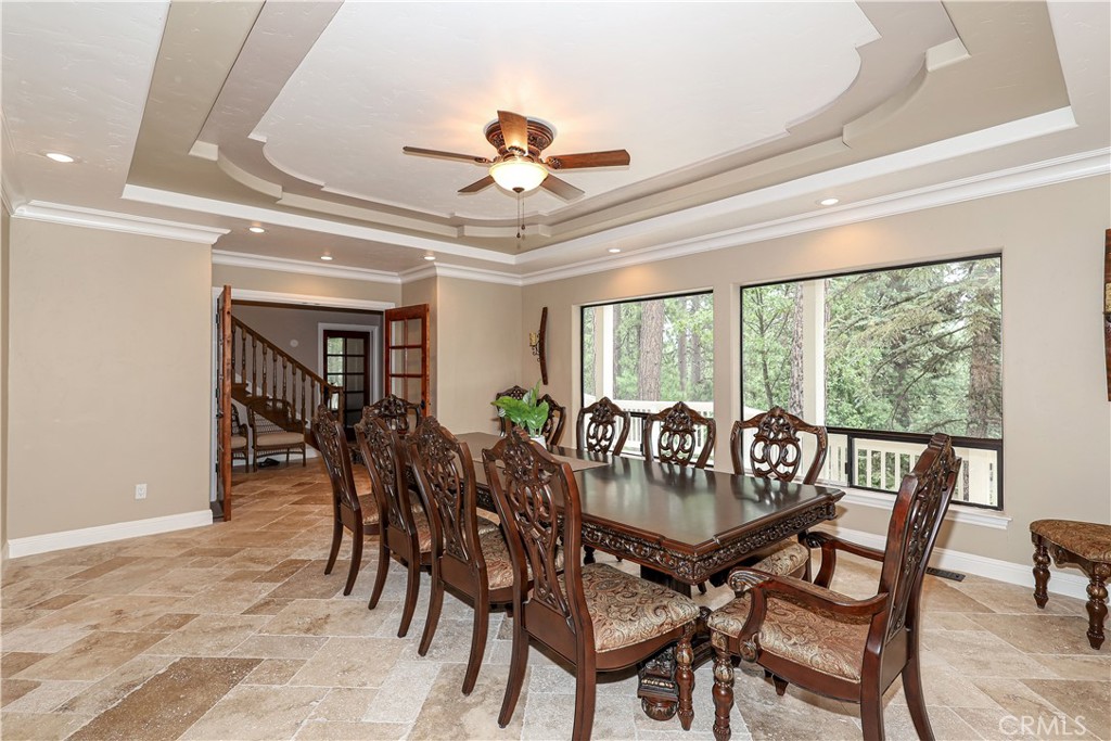 a view of a dining room with furniture window and outside view