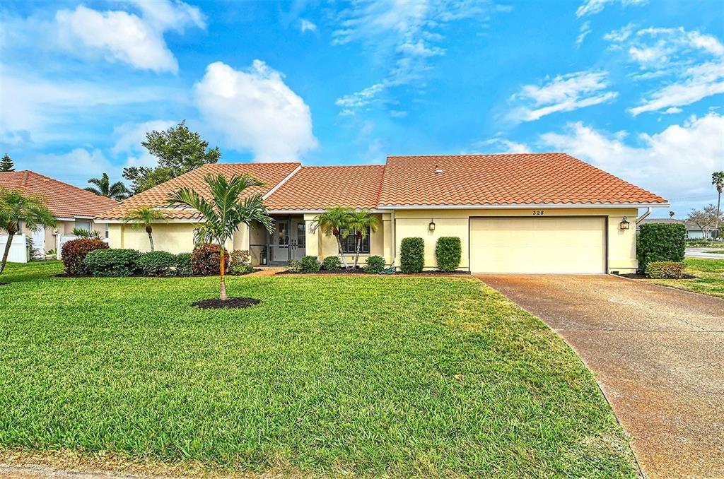 a view of a house with a yard