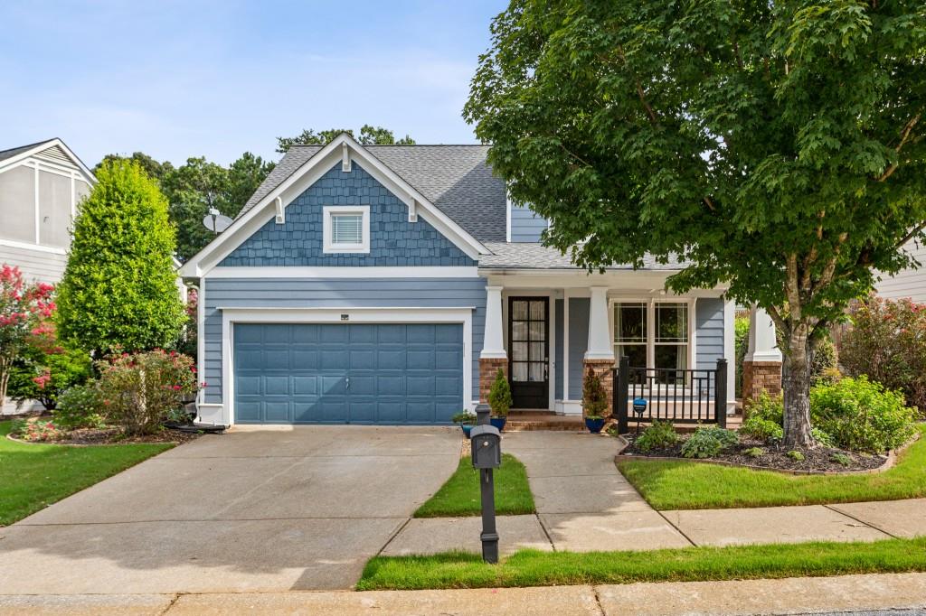 a front view of a house with garden