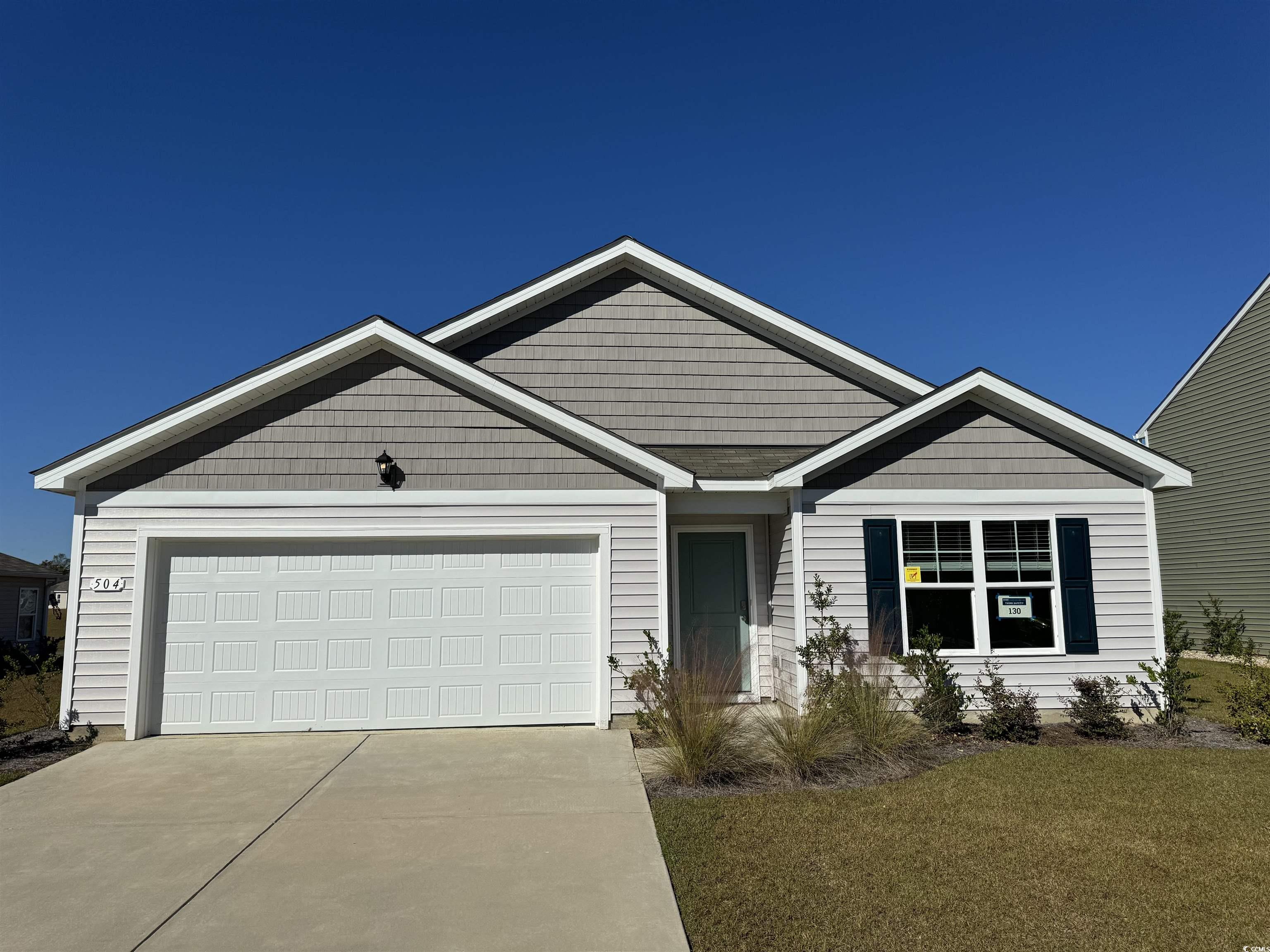 View of front of home with a garage