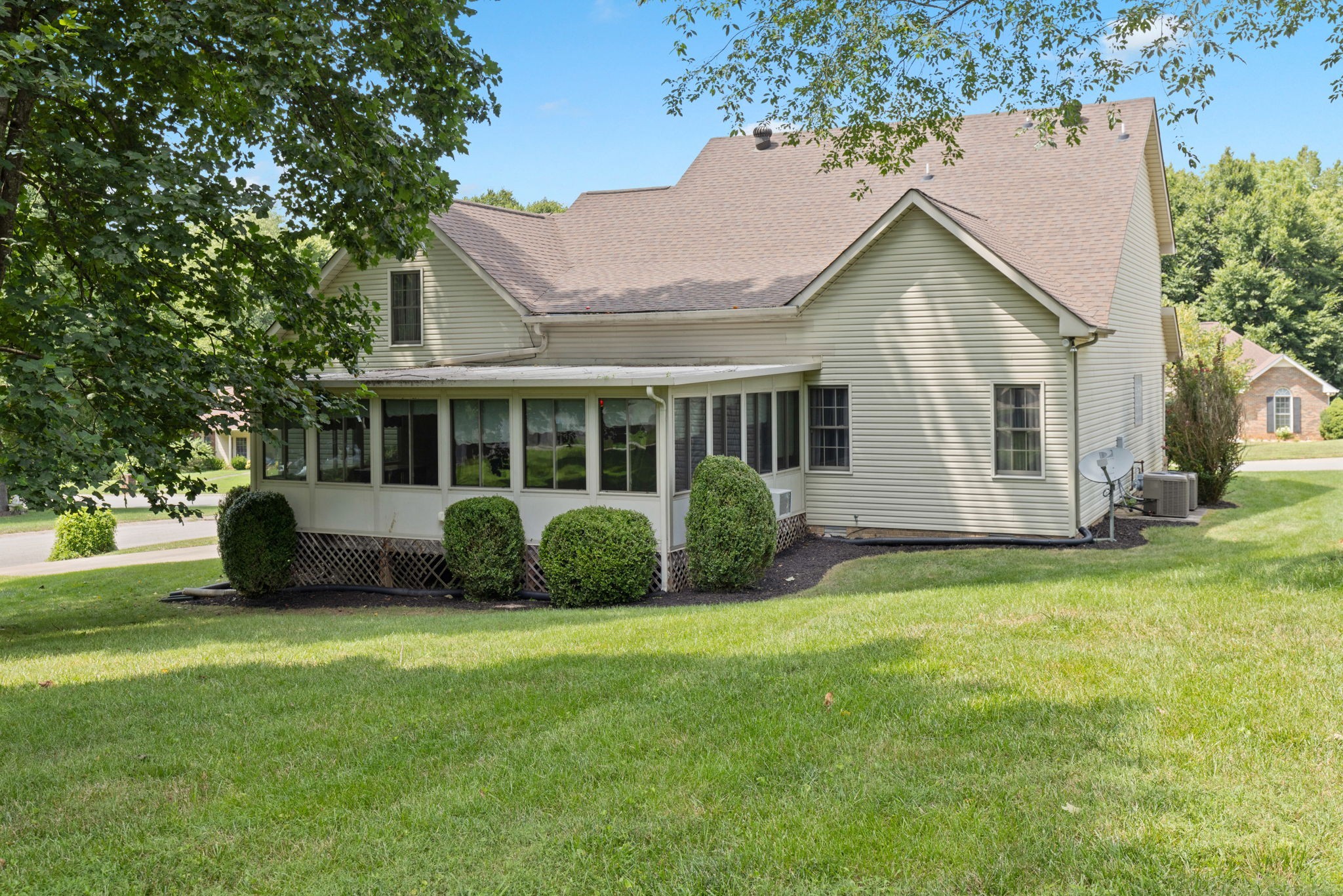 a view of a house with a yard and plants