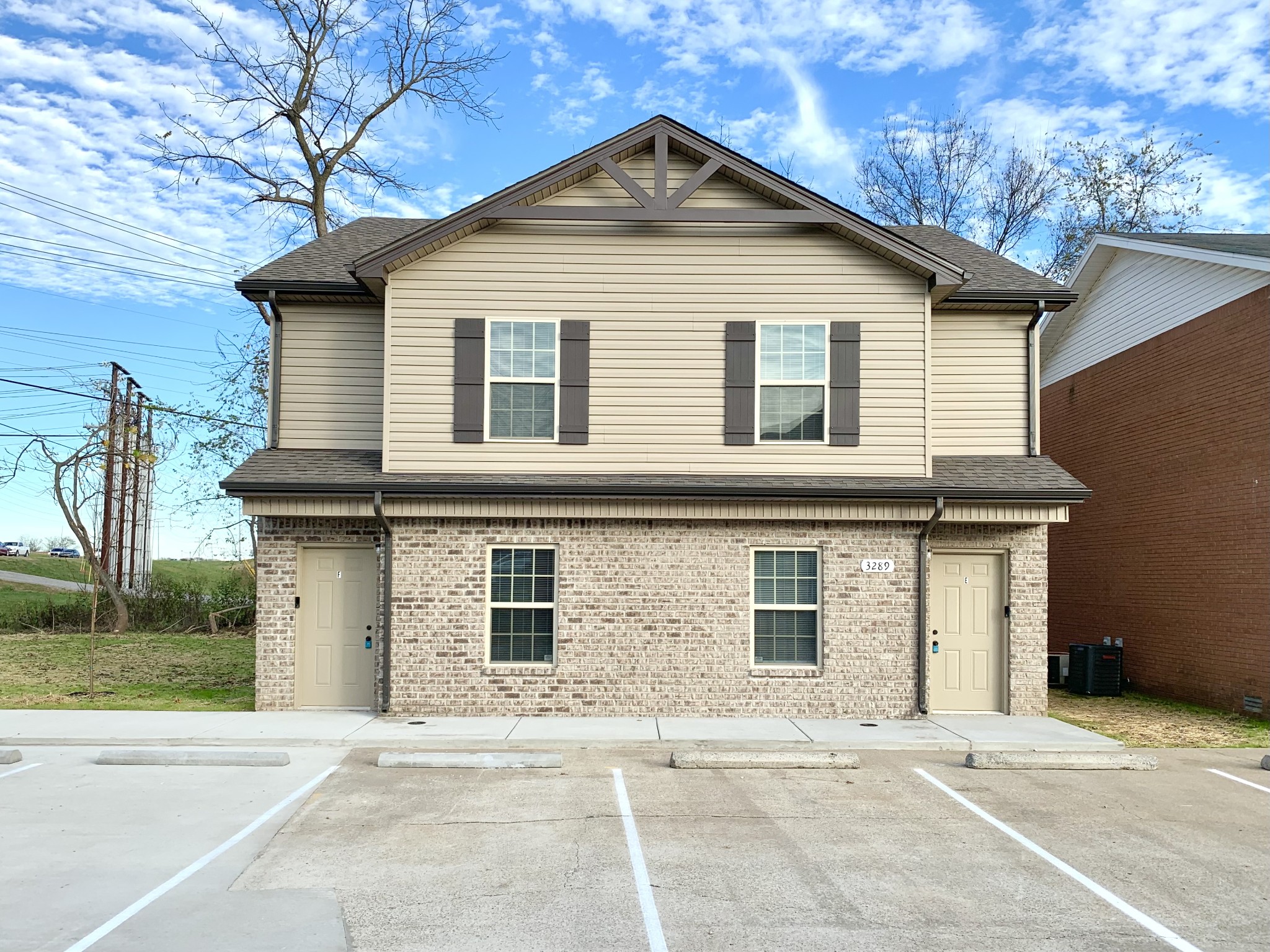 a view of a house with a yard and garage