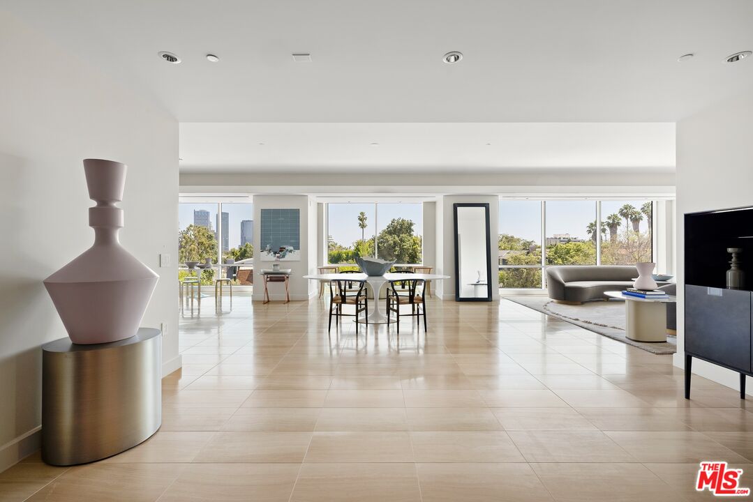 a living room with furniture and a table