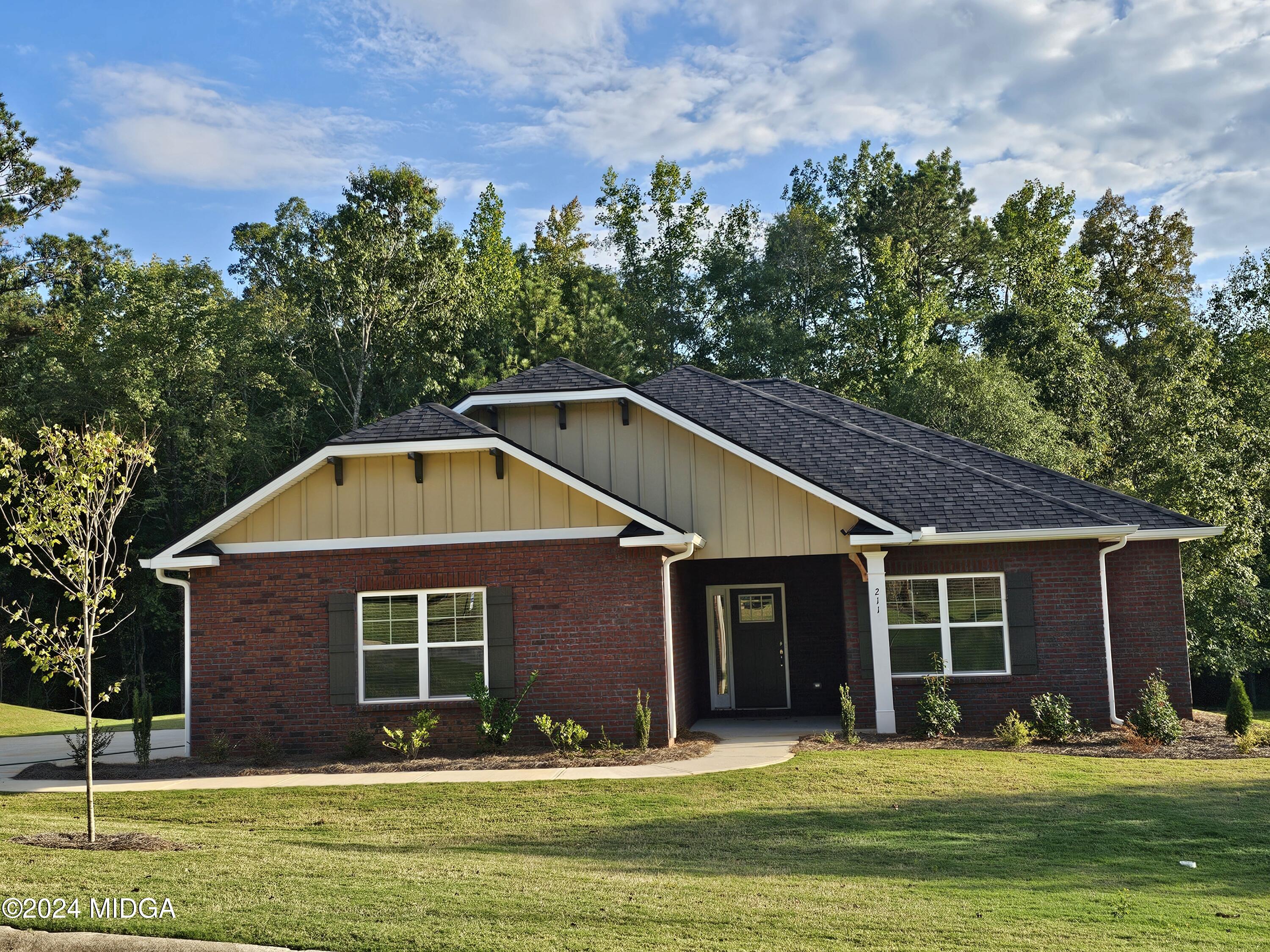 a front view of a house with a yard