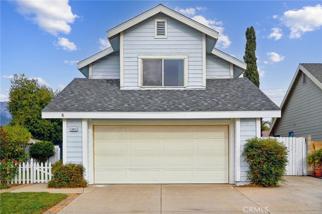 a front view of house with garage