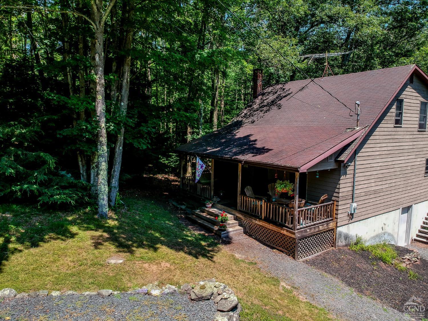 a view of house with outdoor entertaining spaces