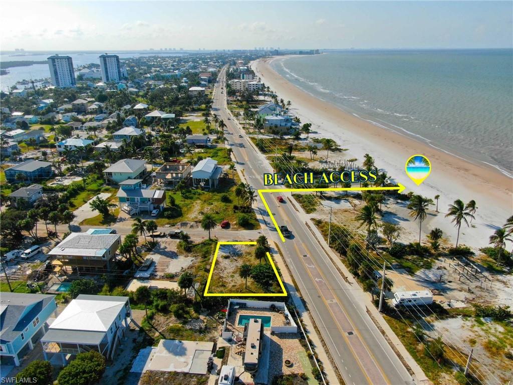 Aerial view with a view of the beach and a water view