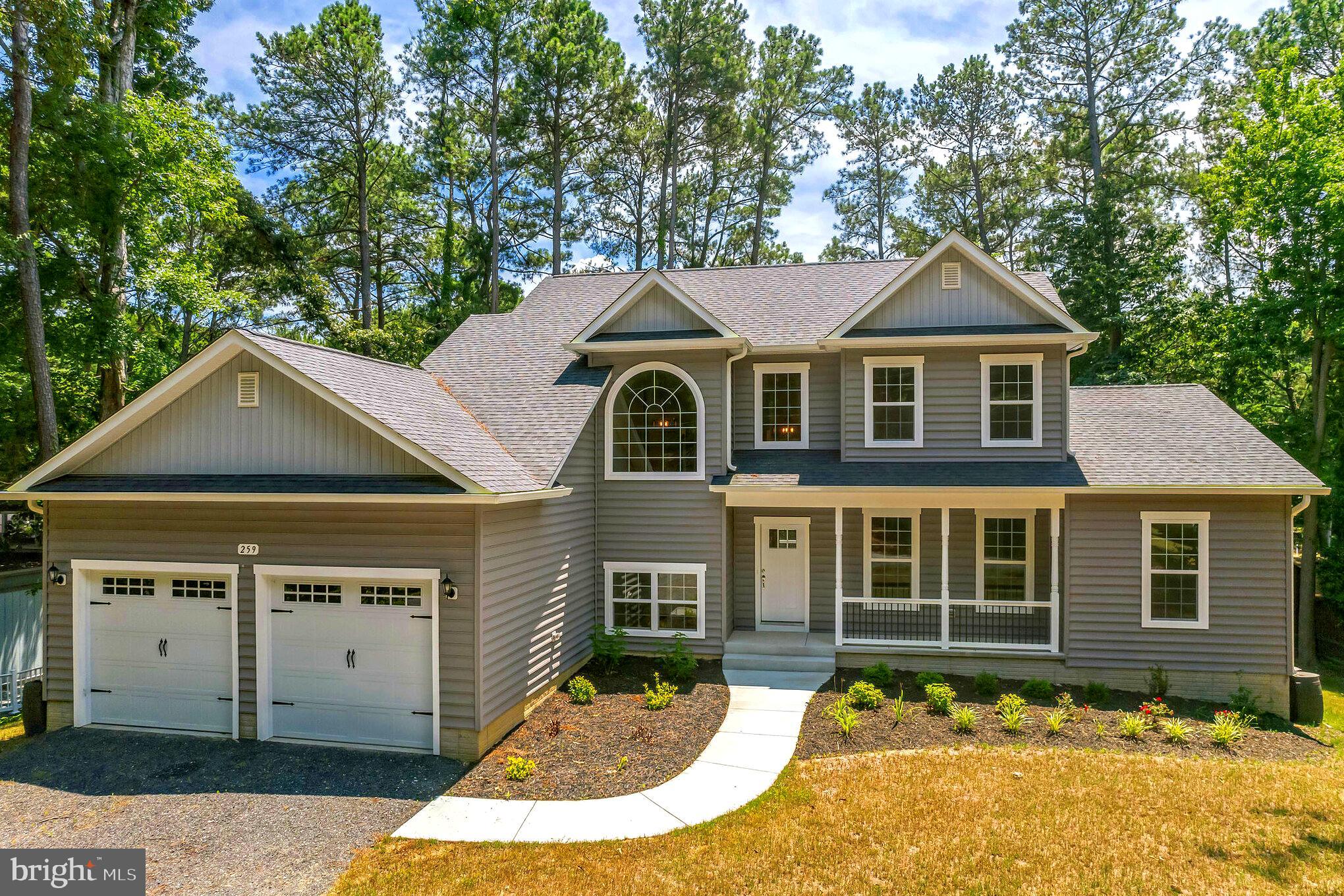 front view of a house with a yard