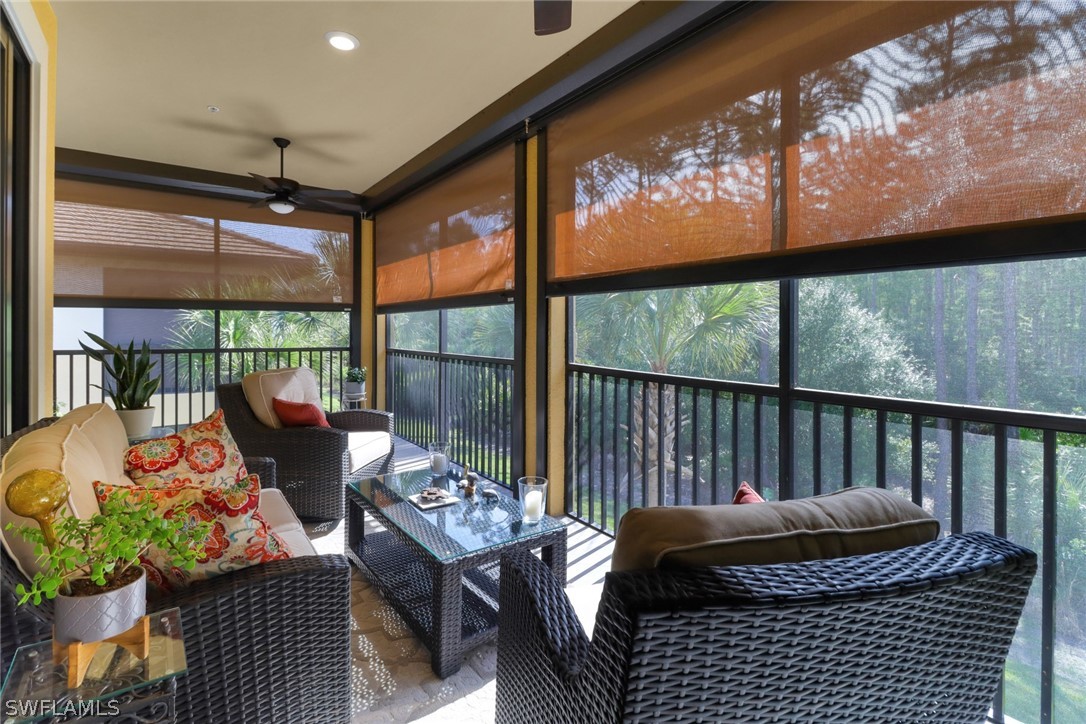 a balcony with furniture and a potted plant