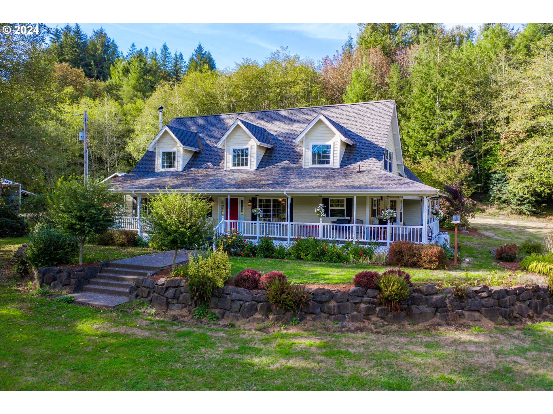 a house with garden in front of it