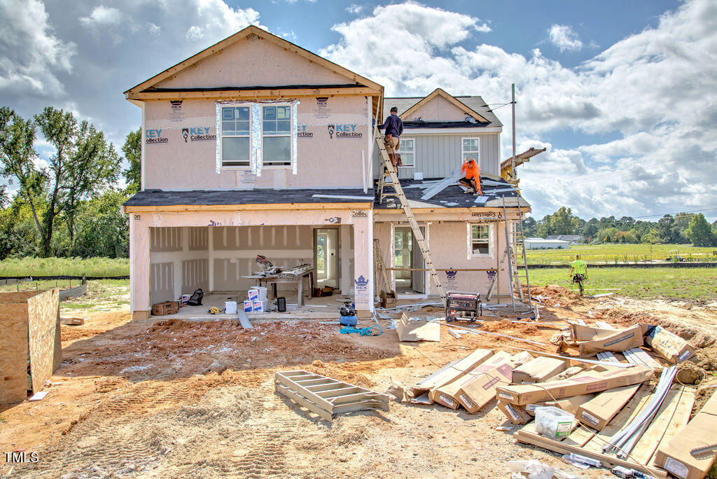 a front view of house with yard and seating space