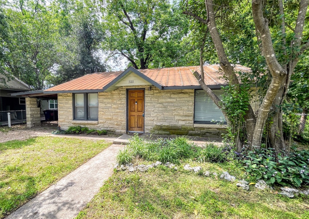 a front view of a house with a yard and porch