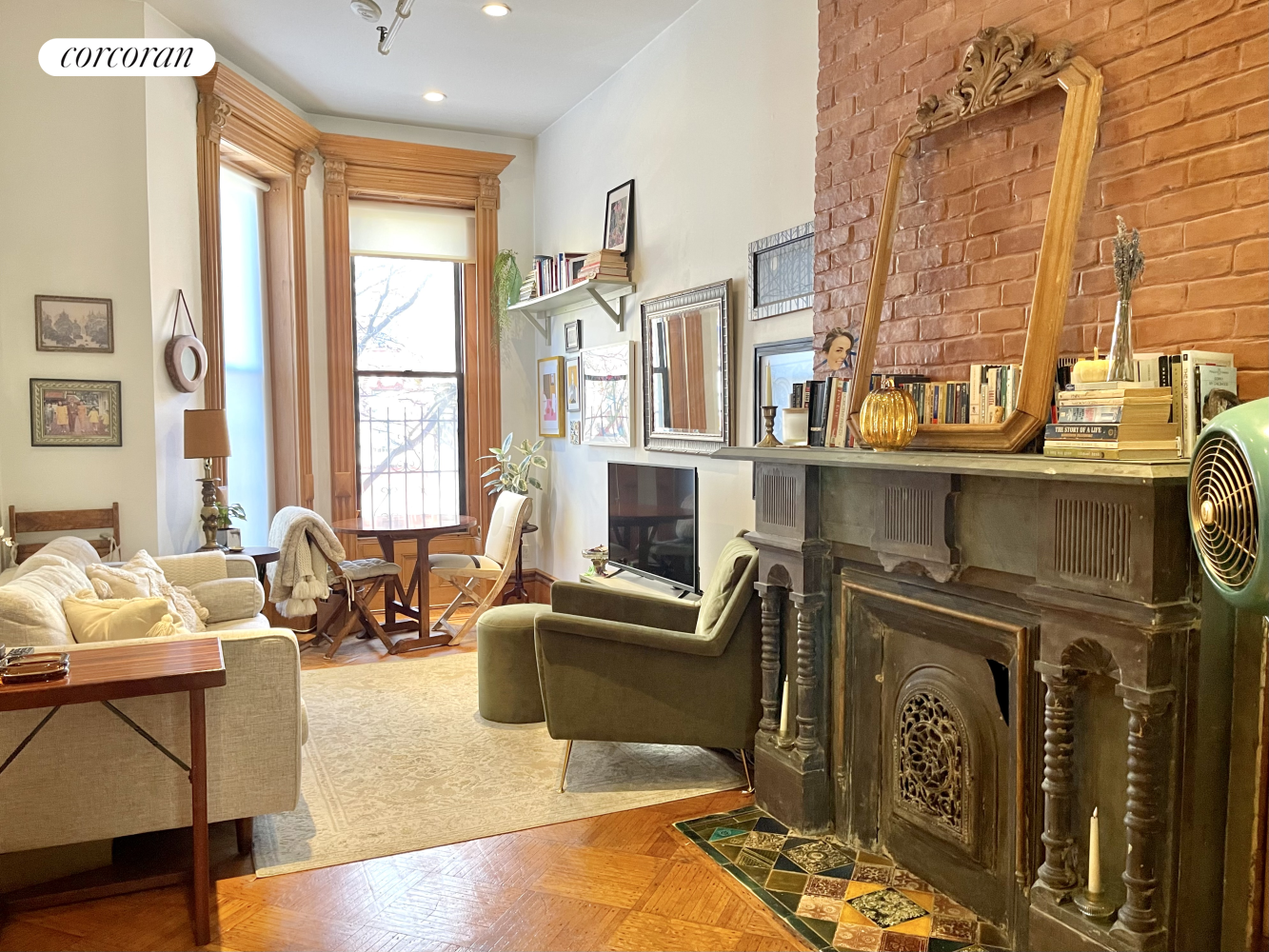 a living room with furniture window and wooden floor