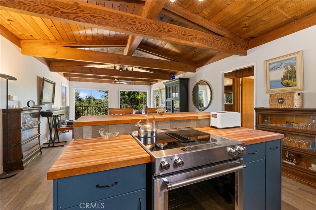 a kitchen with wooden cabinets and stainless steel appliances