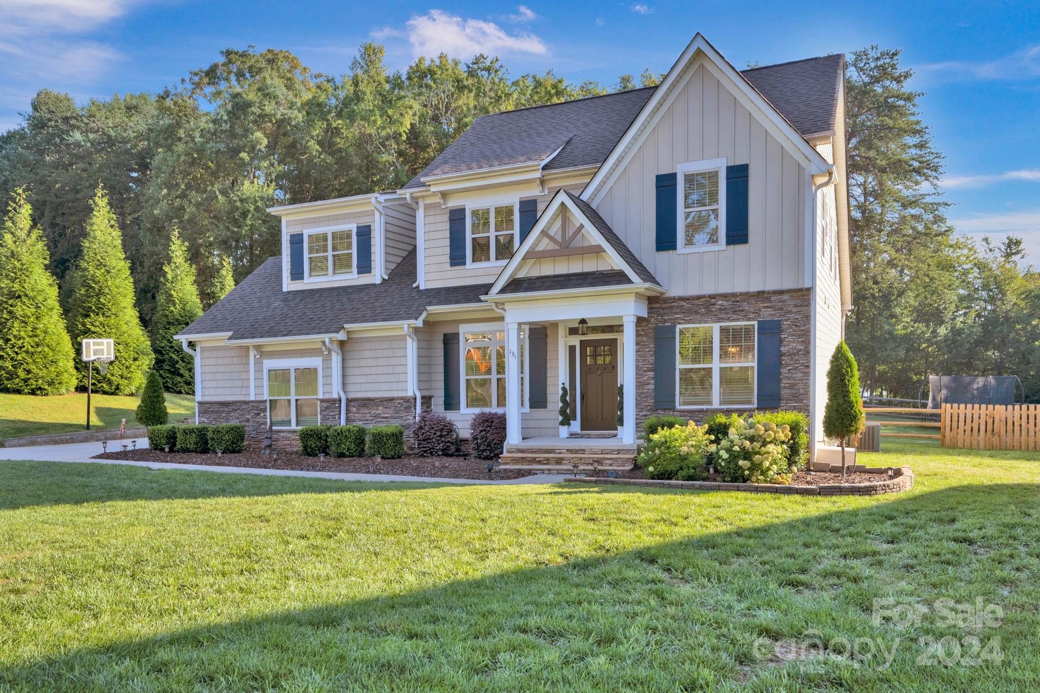 a front view of a house with garden