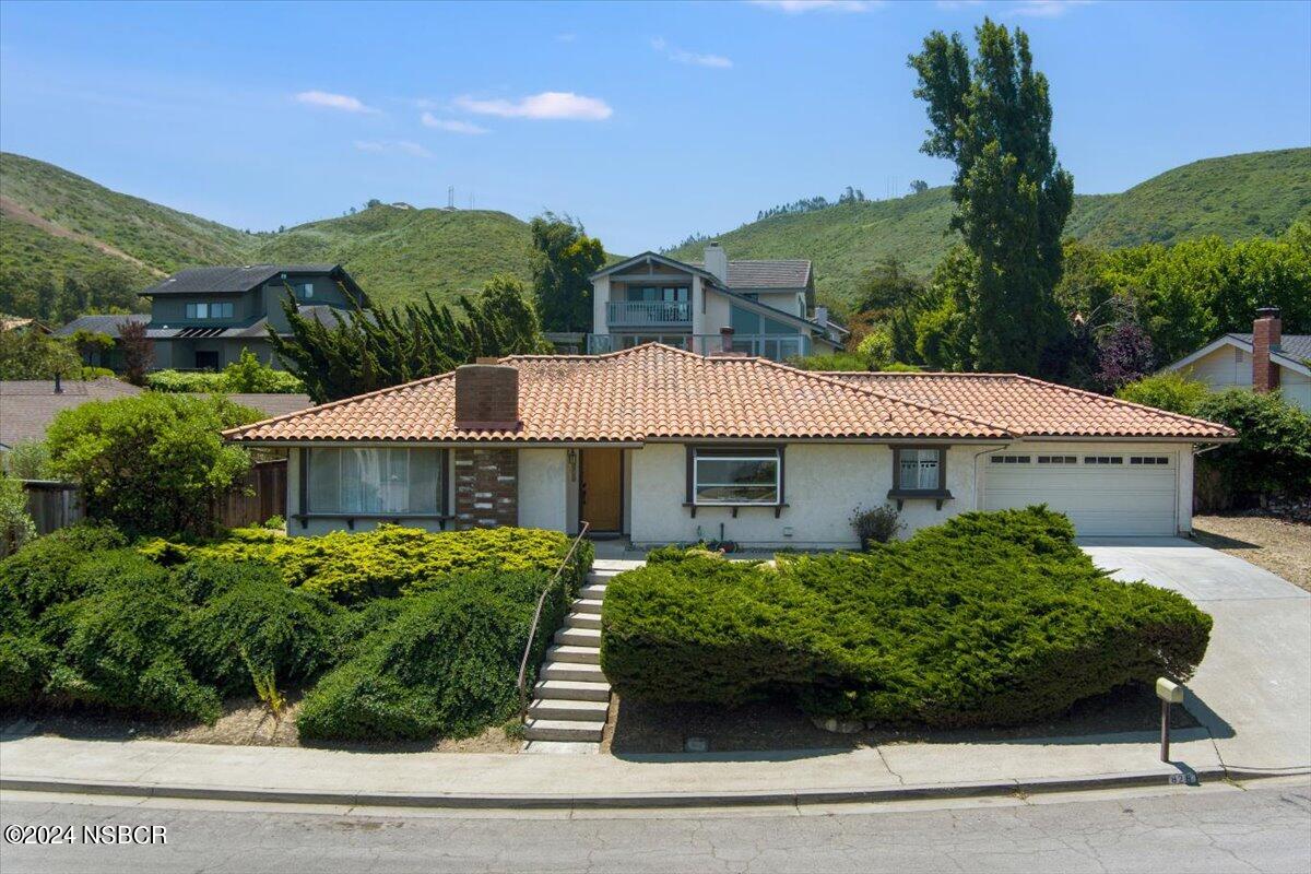 a house view with a garden space