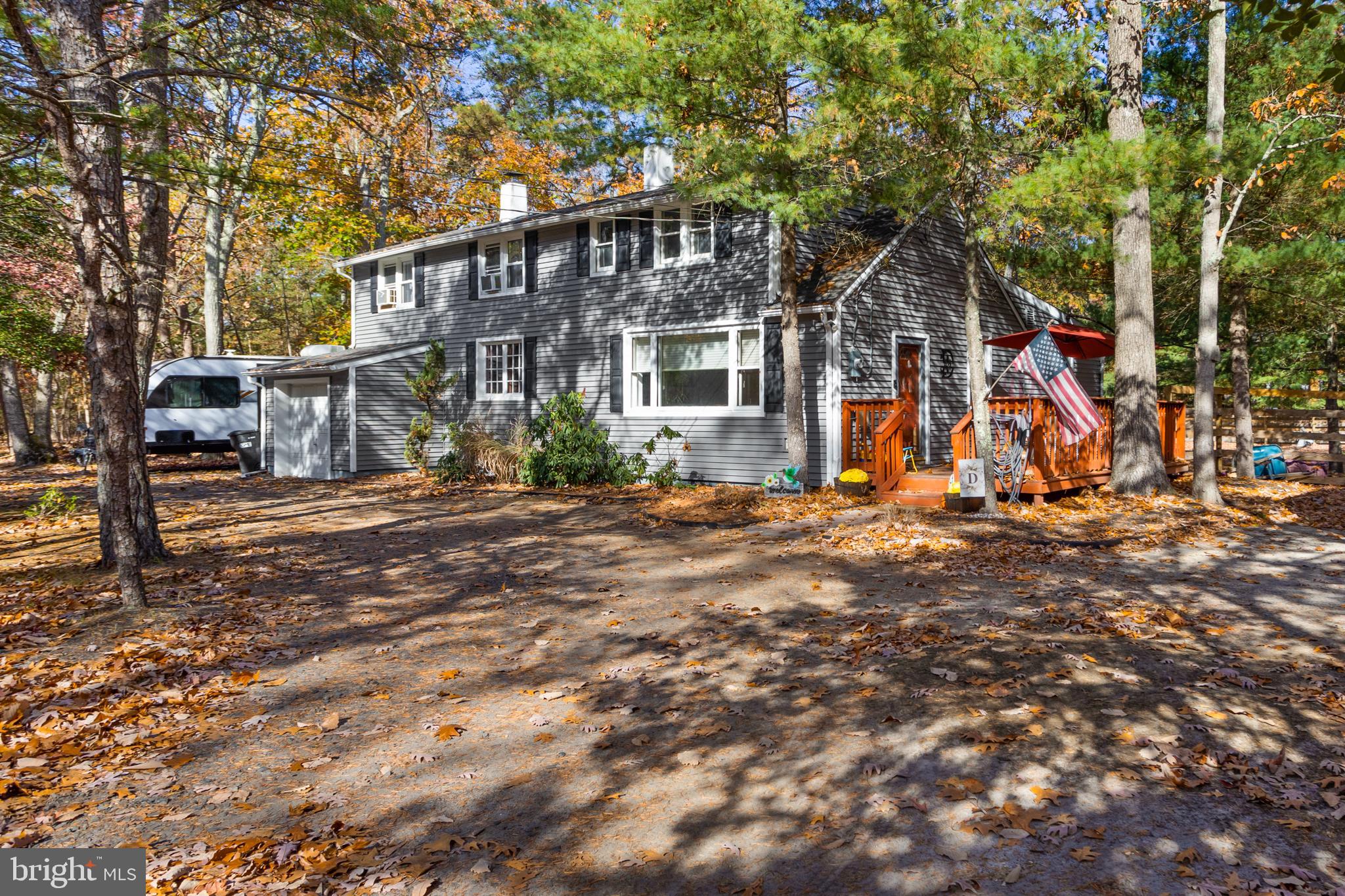 a view of a large house with large trees