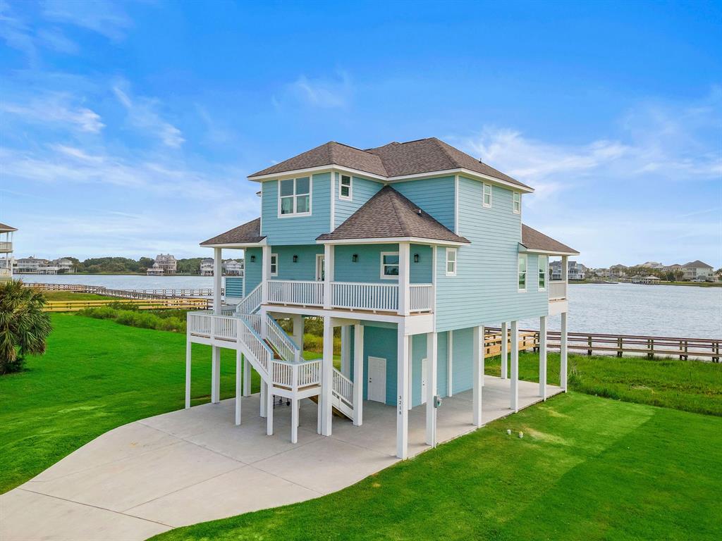 a front view of a house with a yard table and chairs