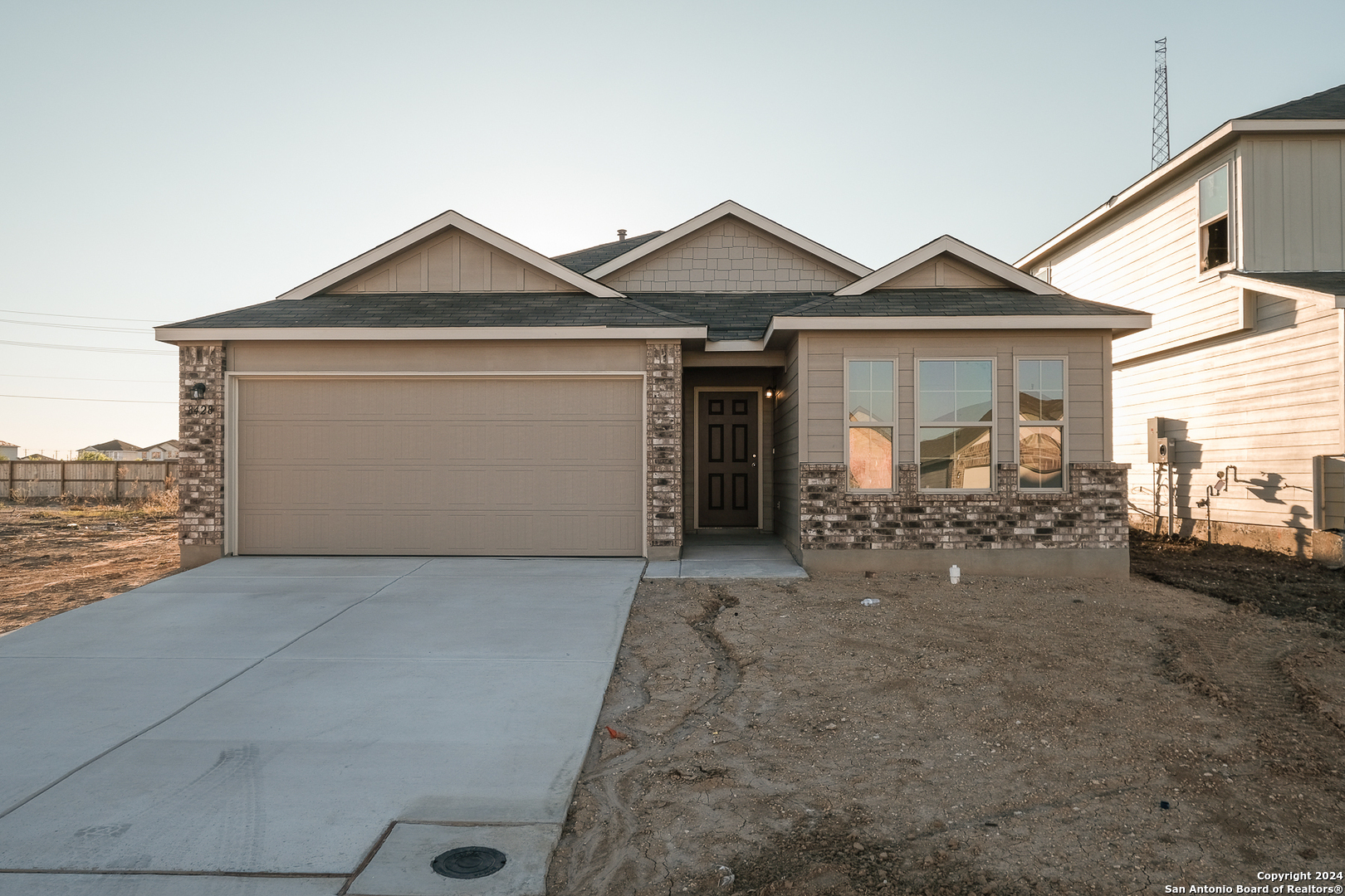 front view of a house with a yard