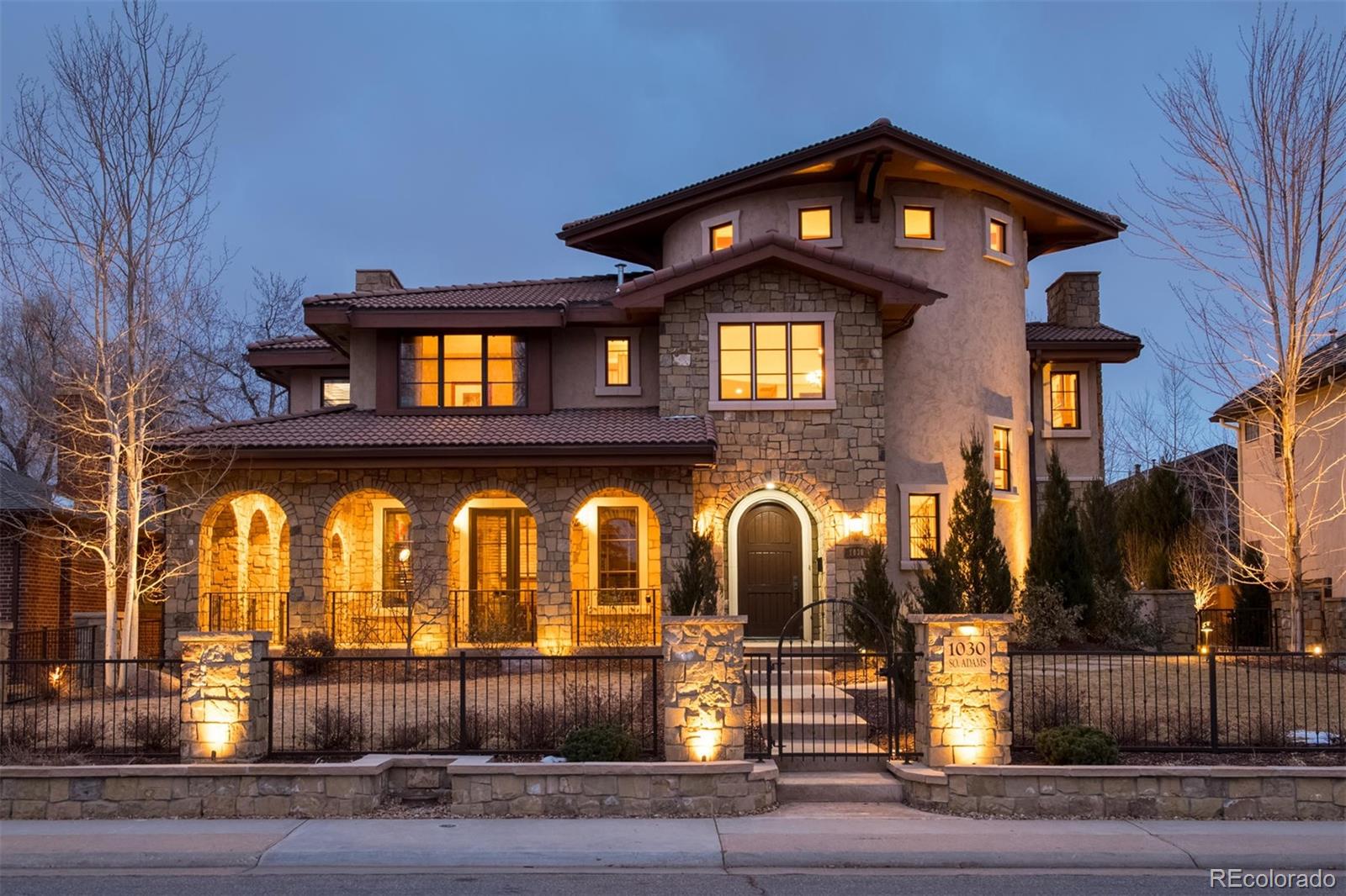 a front view of a house with garage