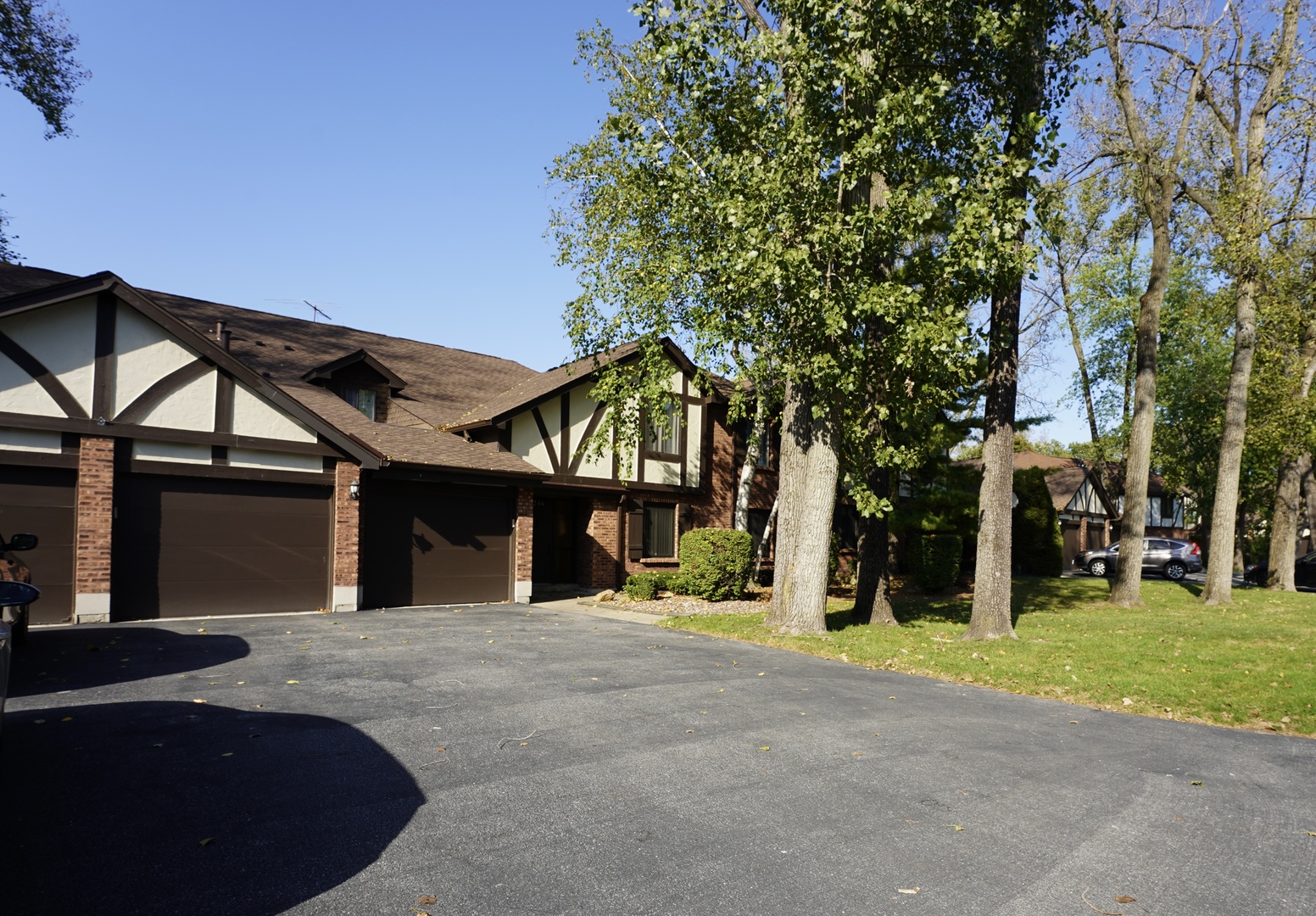 a view of a house with a tree