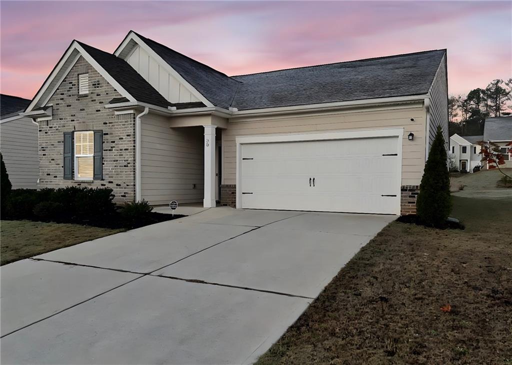 a front view of a house with a garage